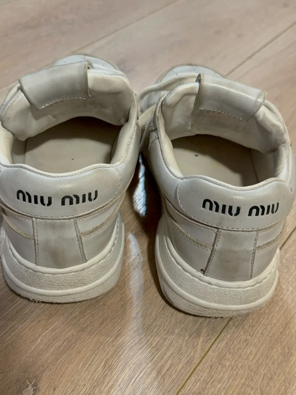Miu Miu Off-White Leather Sneakers with Gold Trim